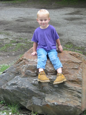Aidan on a rock.