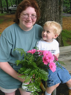 Kama and Aidan (with the flowers Aidan bought for his mommy).