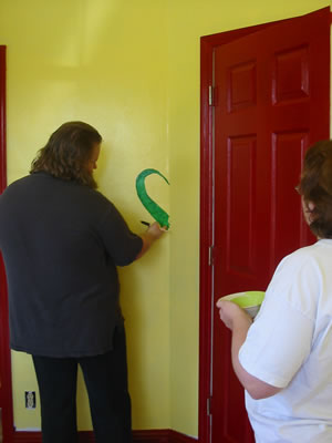 Blair paints a tail.